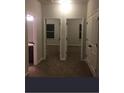 Hallway featuring neutral colored walls and carpet, with access to multiple rooms at 266 Valley Xing, Canton, GA 30114