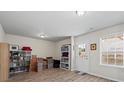 Finished basement features wood-look floors, a large window, and ample storage space at 3782 Chattahoochee Summit Se Dr, Atlanta, GA 30339