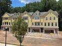 Stylish townhomes feature well-designed exteriors with attached garages in a Gathering-friendly neighborhood at 1977 American Way # 30, Kennesaw, GA 30144