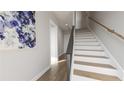 Entry hallway features hardwood floors and staircase at 439 Mezzo Ln, Alpharetta, GA 30009