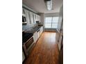 Efficient kitchen featuring stainless steel appliances, granite countertops, and natural light at 465 Salem Woods Se Dr, Marietta, GA 30067