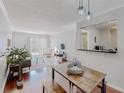 Open-concept living space with bar access to the kitchen, great for entertaining and relaxing at 1181 Church St # G, Decatur, GA 30030