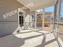 View of the home's screened-in porch, featuring a private outdoor space and view of the yard at 1317 Fern Ridge Ct # 26, Norcross, GA 30093