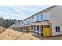 Long row of townhouses showcasing screened-in back porches at 1327 Fern Ridge Ct # 27, Norcross, GA 30093