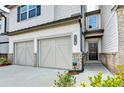 Townhome featuring a two-car garage and brick and siding details at 4118 Haleston Rd, Duluth, GA 30097
