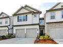 Charming townhome with a two-car garage, and landscaped yard at 4118 Haleston Rd, Duluth, GA 30097