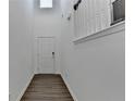Inviting hallway with luxury vinyl flooring and neutral paint at 4118 Haleston Rd, Duluth, GA 30097