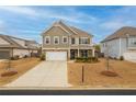 Charming two-story home with stone accents, landscaped front yard, and attached two-car garage at 4480 Sunflower Cir, Cumming, GA 30040