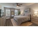 Bright main bedroom with a ceiling fan, lots of natural light, and neutral decor at 4480 Sunflower Cir, Cumming, GA 30040