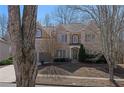 Charming two-story brick home featuring a two-car garage and manicured landscaping at 7290 Weber St, Atlanta, GA 30349