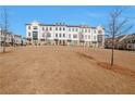 Charming row of townhomes with modern architectural design and landscaped grounds at 1115 Larkin Dr, Buford, GA 30518