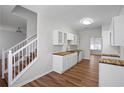 Bright kitchen featuring white cabinets, butcher block countertops, and stainless steel sink at 2413 Charleston Pointe Ct, Atlanta, GA 30316