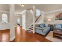 Inviting living room with hardwood floors, neutral walls, and staircase at 2468 Cannon Farm Ln, Duluth, GA 30097