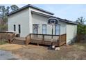 Charming home with a large wooden deck and a basketball hoop, perfect for outdoor fun at 2100 Driftwood Cir, Cumming, GA 30041