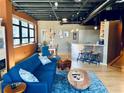 Bright living room showcases a breakfast bar, open floorplan, modern light fixtures, and lots of seating at 878 Peachtree Ne St # 608, Atlanta, GA 30309