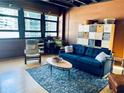 Comfortable living room featuring a contemporary design, a large window, and a cozy seating area at 878 Peachtree Ne St # 608, Atlanta, GA 30309