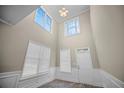 Entryway showcasing high ceilings, windows, and a white door at 4861 Pinnacle Dr, Stone Mountain, GA 30088