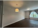 Inviting living room featuring hardwood floors, modern lighting and a bright window at 195 14Th Ne St # 312, Atlanta, GA 30309