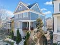 Beautiful home with manicured landscaping and a lovely balcony on the first story at 203 Hubbard Rd, Woodstock, GA 30188