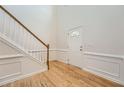 Inviting foyer with hardwood floors, a staircase, and decorative wall trim, leading to the main living areas at 4157 Medlock Woods Dr, Snellville, GA 30039
