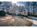 Inviting two-story home featuring a unique architectural design and manicured front yard at 2010 Shadow Bluff Ne Ct, Marietta, GA 30062