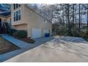 Attached two car garage with ample parking space on a concrete driveway at 2010 Shadow Bluff Ne Ct, Marietta, GA 30062