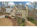 Beautiful two-story home with a welcoming front porch, well-manicured lawn, and mature trees in a suburban setting at 582 Braidwood Nw Dr, Acworth, GA 30101