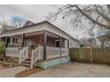 Charming home featuring a stone facade and inviting front porch with white railings at 1852 E Farris Ave, Atlanta, GA 30344