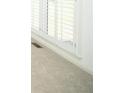 Cozy bedroom featuring neutral carpet and white shuttered windows at 200 Ridge Bluff Ln, Suwanee, GA 30024