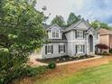 Attractive two-story home with well-maintained landscaping and architectural details at 200 Ridge Bluff Ln, Suwanee, GA 30024