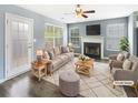 Inviting living room with a cozy fireplace, ample seating, and plenty of natural light at 453 Inkberry Dr, Atlanta, GA 30349
