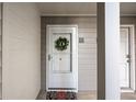 Up close exterior image of unit front door with decorative wreath and colorful welcome mat at 101 Fair Haven Se Way, Smyrna, GA 30080