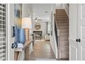 Inviting entryway with hardwood floors, staircase, and view into the living area at 720 Shetland Trl, Cartersville, GA 30121
