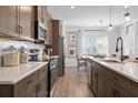 Modern kitchen featuring stainless steel appliances and an island with a breakfast bar at 720 Shetland Trl, Cartersville, GA 30121