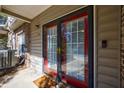 Close up of a home's front door with bright red trim and a covered entryway at 2700 Pine Tree Ne Rd # 4006, Atlanta, GA 30324