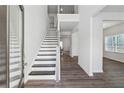 Bright foyer with hardwood floors and staircase leading to the upper level at 744 Clark Lake Estates Dr, Grayson, GA 30017