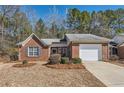 Lovely single-story brick home with attached garage and manicured lawn at 175 Lagrange Ct, Fayetteville, GA 30214