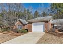 Single story brick house with attached garage and concrete driveway at 175 Lagrange Ct, Fayetteville, GA 30214