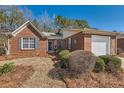 Charming brick home with attached garage and mature landscaping at 175 Lagrange Ct, Fayetteville, GA 30214