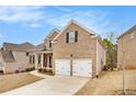 Beautiful two-story brick home with a two-car garage and well-maintained landscaping at 2031 Broadmoor Way, Fairburn, GA 30213