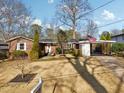 Inviting single-story brick home with a covered carport, showcasing a well-maintained front yard at 3831 Montford Dr, Atlanta, GA 30341