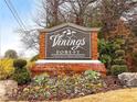 Entrance sign for Vinings Forest, a community of private residences, amidst landscaped greenery at 805 Vinings Forest Se Ln, Smyrna, GA 30080