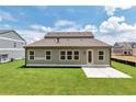 Expansive backyard with well-kept lawn, ready for outdoor entertaining with a private patio and green space at 329 Willow Cv, Canton, GA 30114