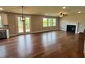 Spacious living room with hardwood floors, fireplace and door to deck at 223 Willow St, Canton, GA 30114