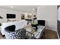Open living space features a modern decor, with clear views into the kitchen and dining areas at 2474 Bayberry St # 33, Acworth, GA 30101