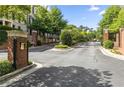 View of the gated entrance to this luxury townhome community at 3635 E Paces Ne Cir # 1405, Atlanta, GA 30326