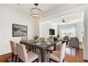 Bright dining room connected to the living room with hardwood floors at 3635 E Paces Ne Cir # 1405, Atlanta, GA 30326