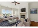 Cozy living room with fireplace, large windows, and comfortable seating area at 3635 E Paces Ne Cir # 1405, Atlanta, GA 30326