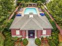 Aerial view of a community pool with lounge chairs and shaded seating areas at 3635 E Paces Ne Cir # 1405, Atlanta, GA 30326