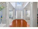 Grand foyer featuring hardwood floors, high ceilings, and elegant architectural details and lots of natural light at 4381 Prather Son Dr, Loganville, GA 30052